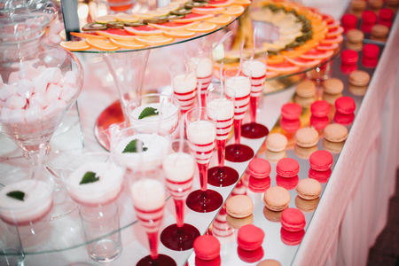 Different delicious desserts and cakes on the buffet table.の写真素材