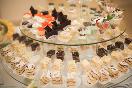 Different delicious desserts and cakes on the buffet table.の写真素材