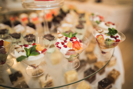 Different delicious desserts and cakes on the buffet table.の写真素材