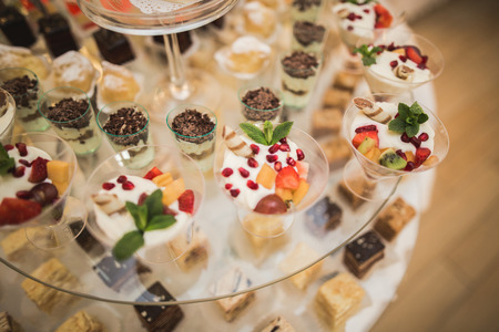 Different delicious desserts and cakes on the buffet table.の写真素材