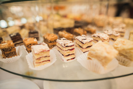 Different delicious desserts and cakes on the buffet table.の写真素材