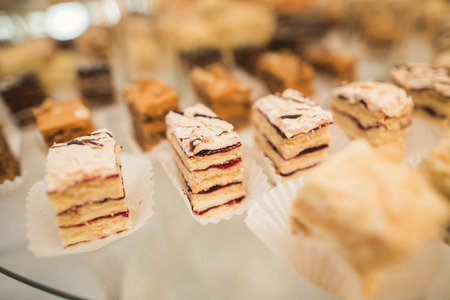 Different delicious desserts and cakes on the buffet table.の写真素材