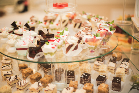 Different delicious desserts and cakes on the buffet table.の写真素材