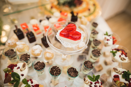 Different delicious desserts and cakes on the buffet table.の写真素材
