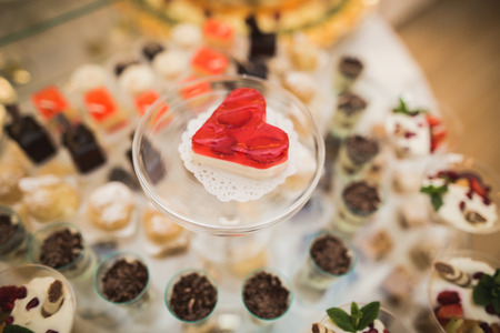 Different delicious desserts and cakes on the buffet table.の写真素材