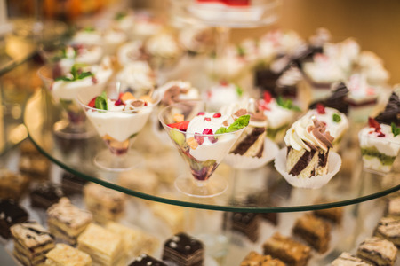 Different delicious desserts and cakes on the buffet table.の写真素材