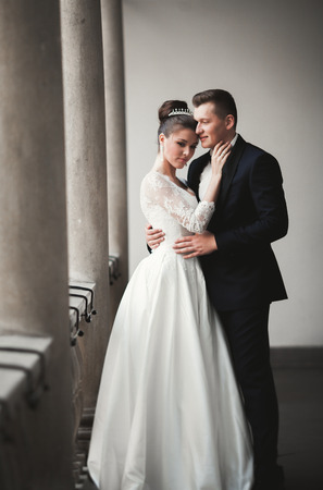 Luxury married wedding couple, bride and groom posing in old city.の写真素材