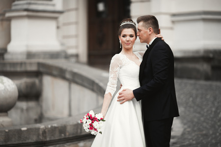Luxury married wedding couple, bride and groom posing in old city.の写真素材