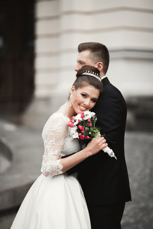 Luxury married wedding couple, bride and groom posing in old city.の写真素材