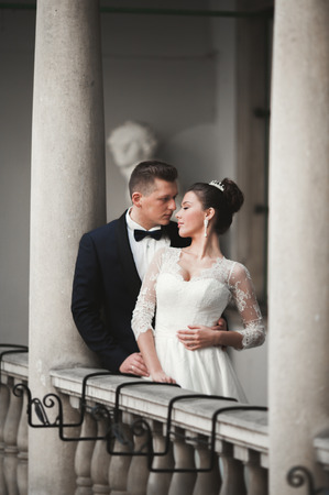 Luxury married wedding couple, bride and groom posing in old city.の写真素材
