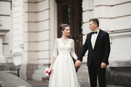 Luxury married wedding couple, bride and groom posing in old city.の写真素材