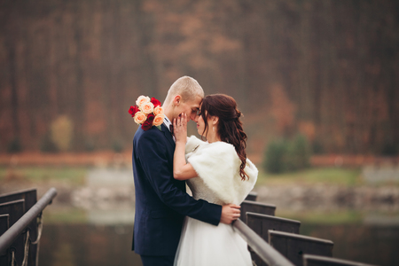 married young wedding couple near lake.の写真素材