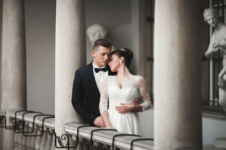 Luxury married wedding couple, bride and groom posing in old city.の写真素材