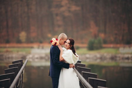 married young wedding couple near lake.の写真素材