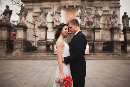 Wedding couple, bride and groom near a church in Krakow.の写真素材