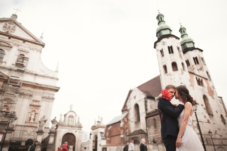Wedding couple, bride and groom near a church in Krakow.の写真素材