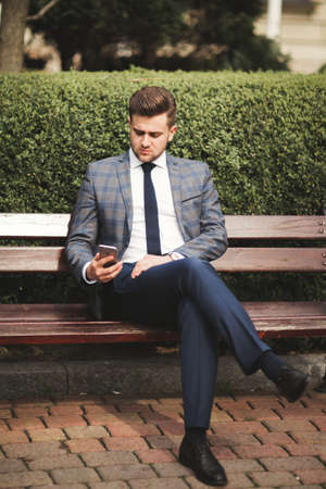 phone in the hands of a businessmanの写真素材