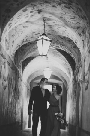 Wedding couple in big futuristic old tunnel.の写真素材