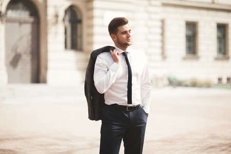 Handsome stylish young businessman posing portrait outdoor.の写真素材