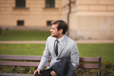Handsome stylish young businessman posing portrait outdoor.の写真素材