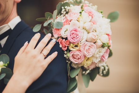 Pretty good wedding bouquet of various flowers in hand.の写真素材