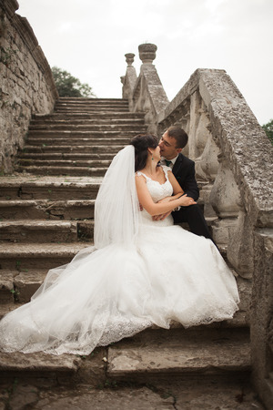Beautiful romantic wedding couple of newlyweds in old castle.の写真素材