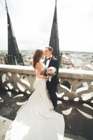 Gorgeous wedding couple walking in the old city of Lviv.の写真素材