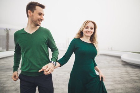Happy couple on the pier, young family in love spending honeymoon vacation luxury islands.の写真素材