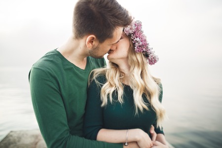 Happy couple on the pier, young family in love spending honeymoon vacation luxury islands.の写真素材