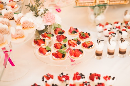 Buffet with a variety of delicious sweets, food ideas, celebration.の写真素材