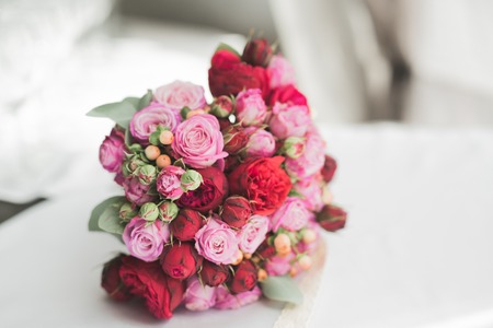 Bouquet of beautiful flowers and greenery is on the green grass.の写真素材