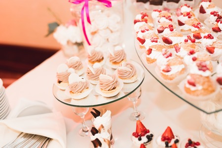 Different kinds of baked sweets on a buffet.