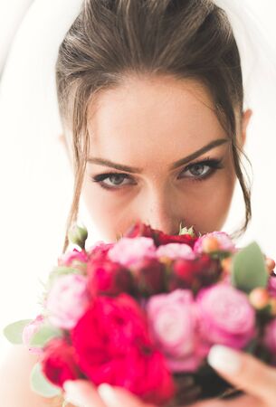 Luxury wedding bride, girl posing and smiling with bouquet.の写真素材
