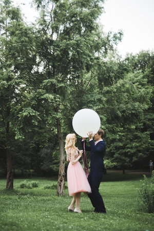 Loving couple on the background of the setting sun, . Just married. Walk at sunset.の写真素材