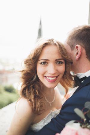 Gorgeous wedding couple walking in the old city of Lviv.の写真素材