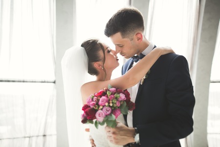 Luxury married wedding couple, bride and groom posing in old city.の写真素材