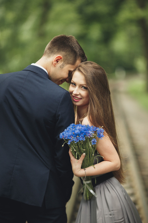 Loving Couple. Boy and girl walking in the beautiful park.の写真素材
