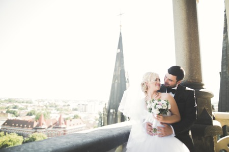 Gorgeous wedding couple walking in the old city of Lviv.の写真素材