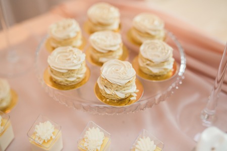Different kinds of baked sweets on a buffet.