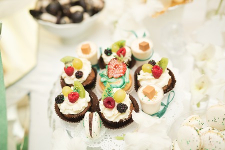 Different kinds of baked sweets on a buffet.の写真素材