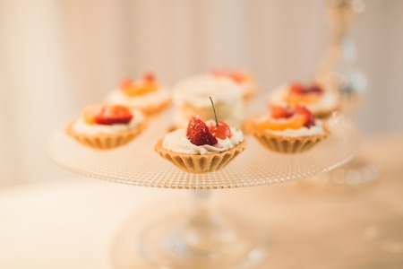 Different kinds of baked sweets on a buffet.の写真素材