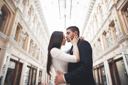Loving couple posing in the old town.の写真素材