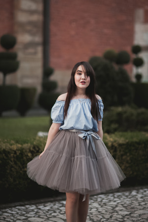 Young Asians girl with modern dress posing in an old Krakow.の写真素材