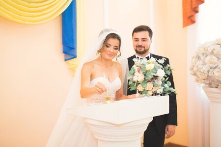 Wedding couple bride and groom leaving their signaturesの写真素材