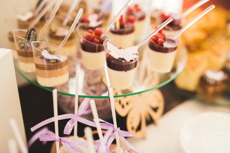Different kinds of baked sweets on a buffet.の写真素材
