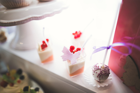 Different kinds of baked sweets on a buffetの写真素材