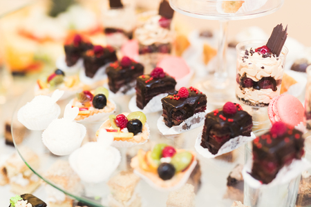 Different kinds of baked sweets on a buffetの写真素材