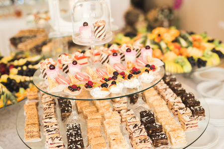Different kinds of baked sweets on a buffet.の写真素材