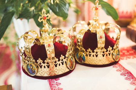 Golden crowns lying on the table in churchの写真素材