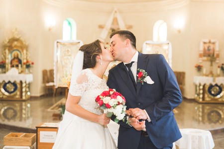 Wedding couple bide and groom get married in a churchの写真素材
